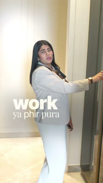 Presenter opening a mirrored wardrobe door during the TARC Kailasa house tour